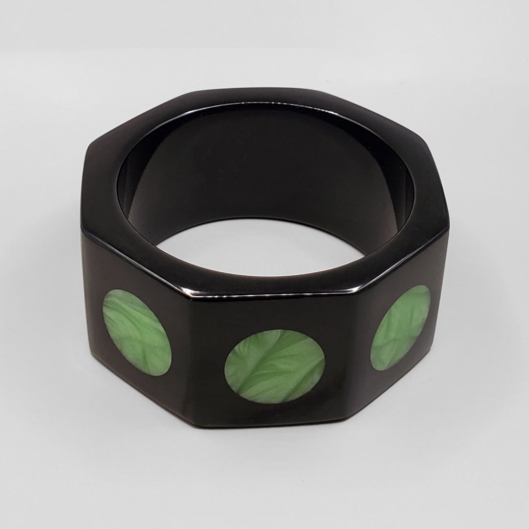 BLACK OCTAGON WITH  GREEN MOONS