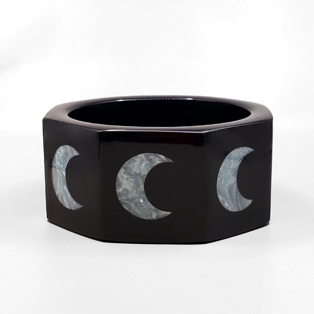 BLACK OCTAGON INLAID WITH SILVERY CRESCENT MOONS
