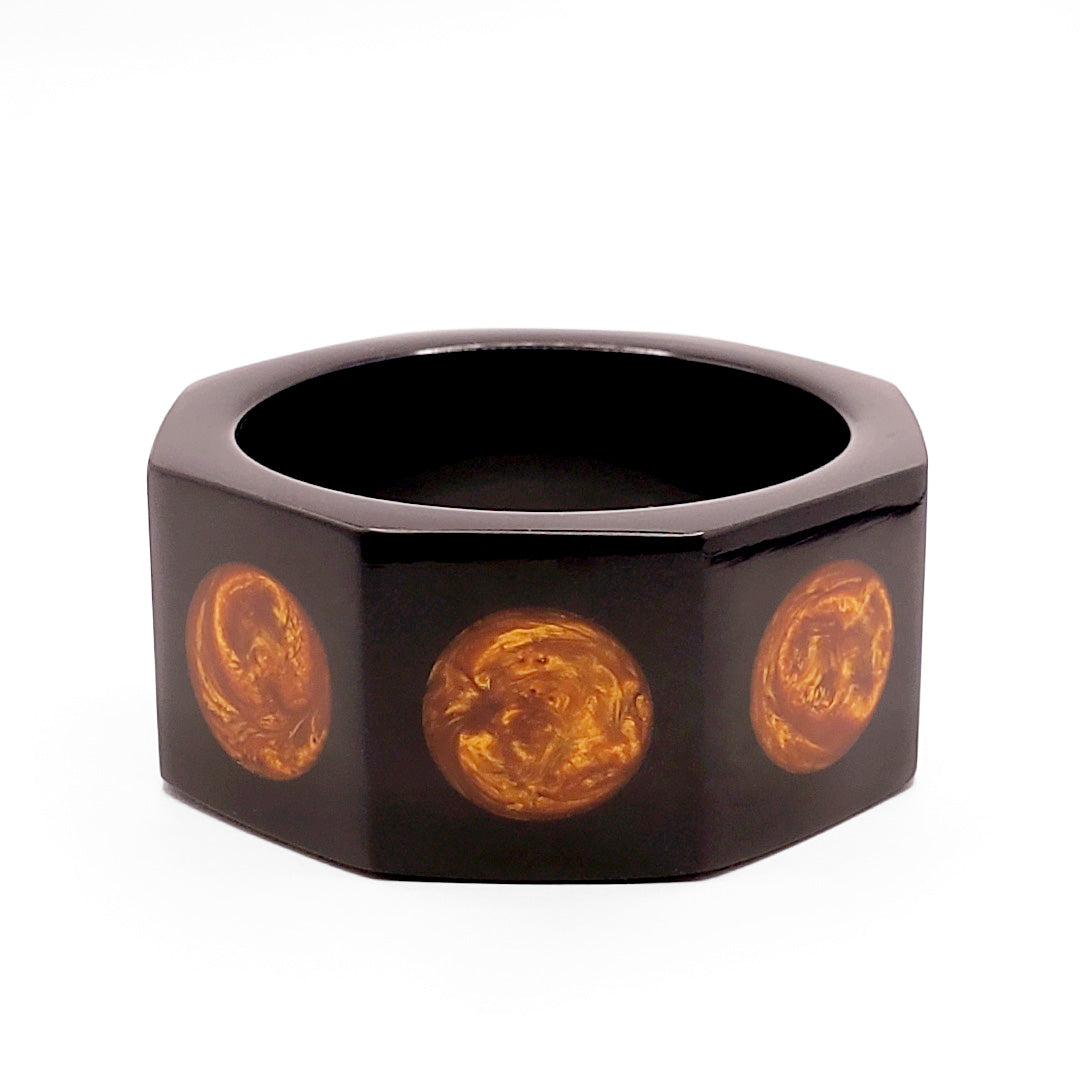 BLACK OCTAGON WITH  AZTEC GOLD  SUNS