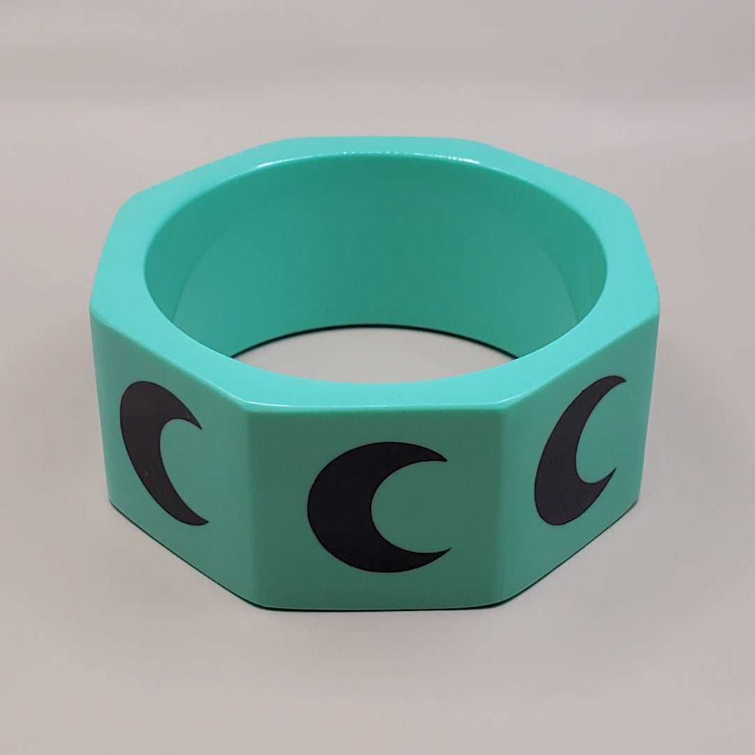 TURQUOISE OCTAGON WITH BLACK CRESCENT MOONS