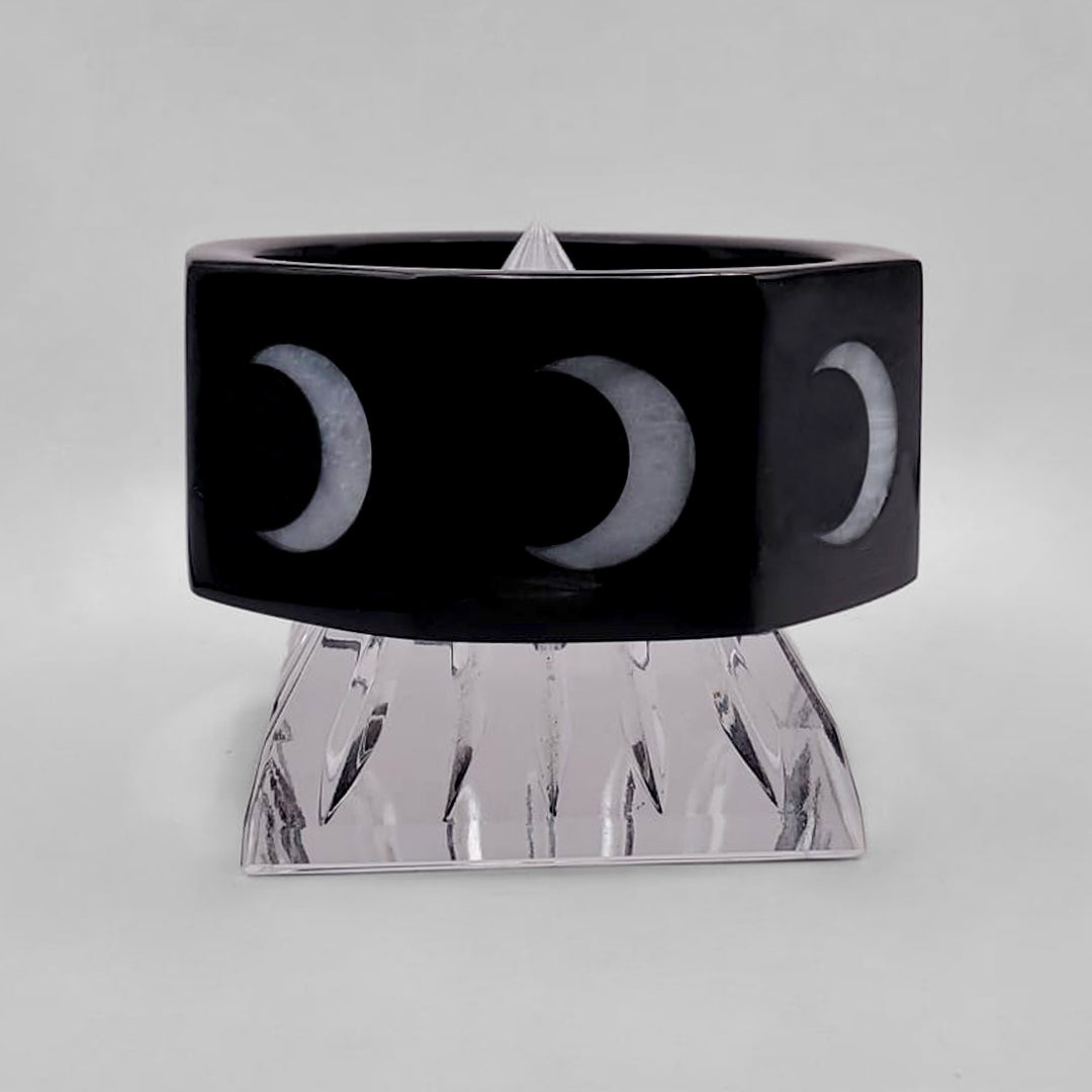 CLOUD-COLORED CRESCENT MOONS ON BLACK OCTAGON